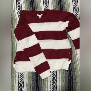 Red and white knit sweater with side lace up detail